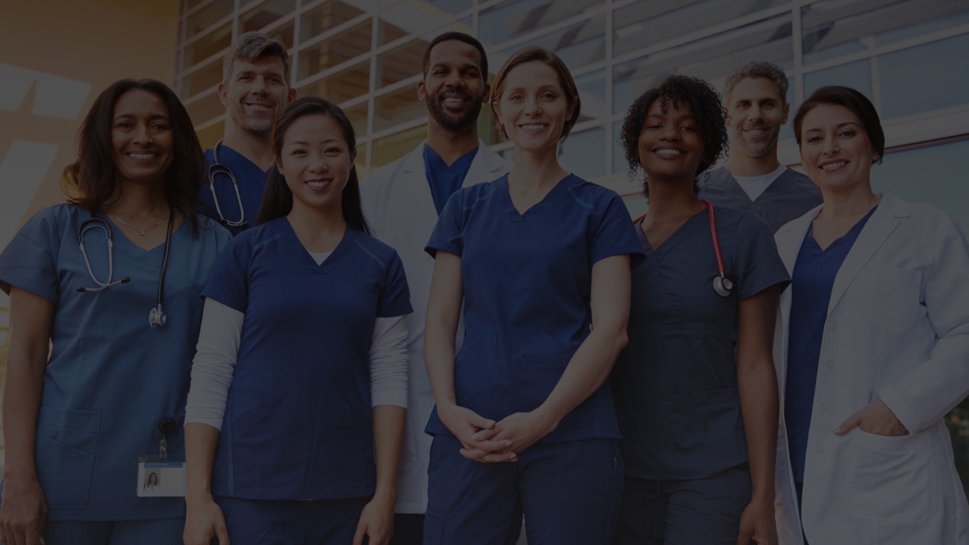 A diverse group of medical professionals smiling