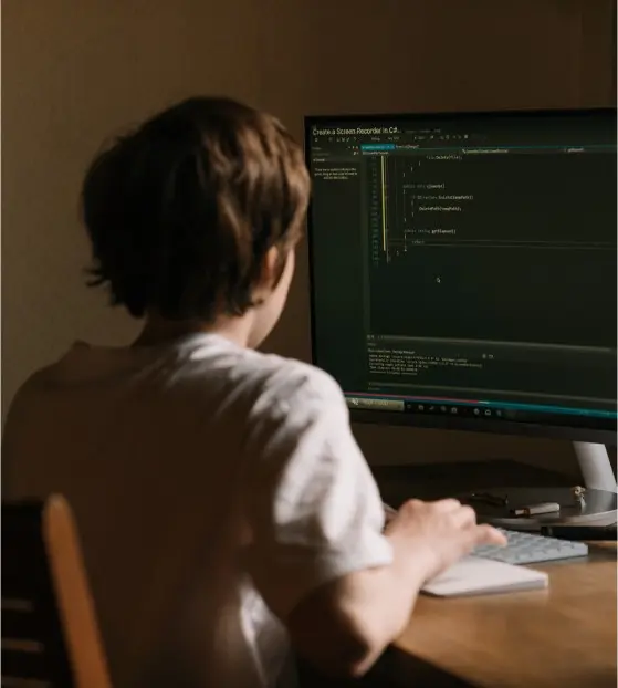 Developer coding education software on a computer at a desk