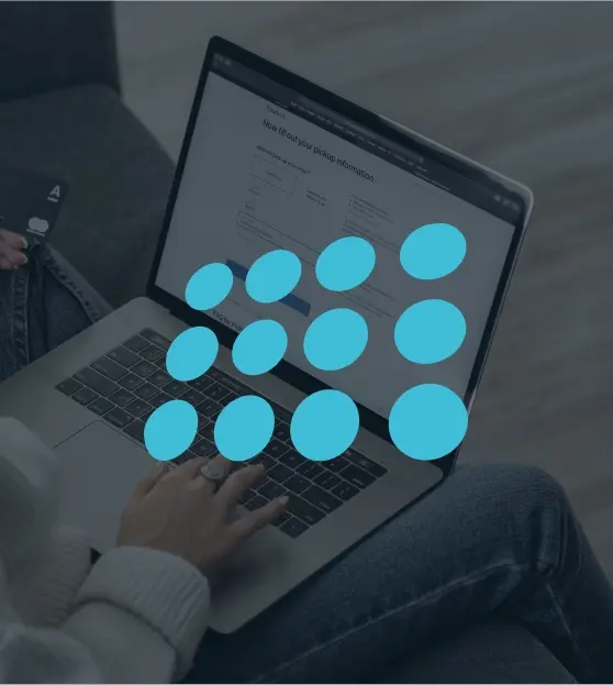 Laptop with blue circle graphic and user in background