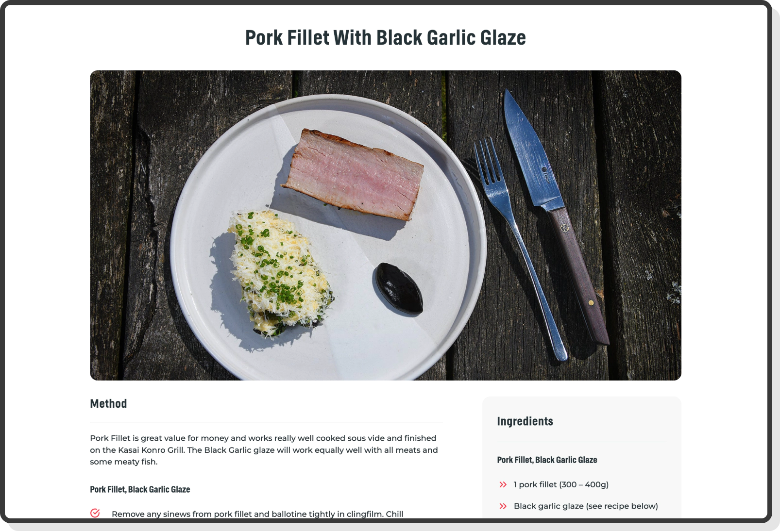 Pork fillet with black garlic glaze served on rustic table